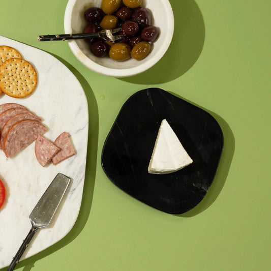 Plato pequeño de mármol negro de forma libre